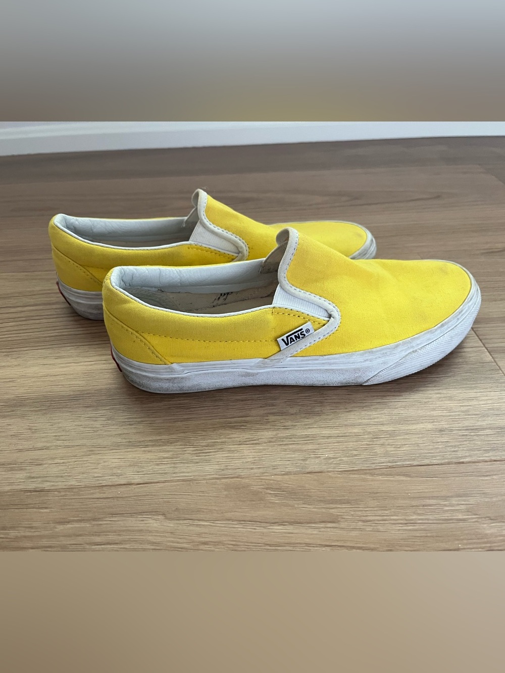 Vans Women’s Slip-On Canvas Sneakers in Yellow with White Trim